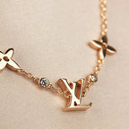 TimiSTAR AND SUN 7 MOTIFS GOLD BRACELET