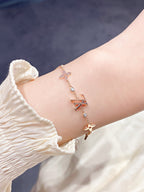 TimiSTAR AND SUN 7 MOTIFS GOLD BRACELET